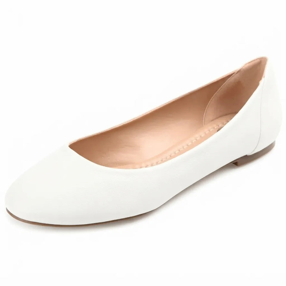 A single white ballet flat shoe with a pointed toe and a light tan interior, shown from a three-quarters angle on a white background.