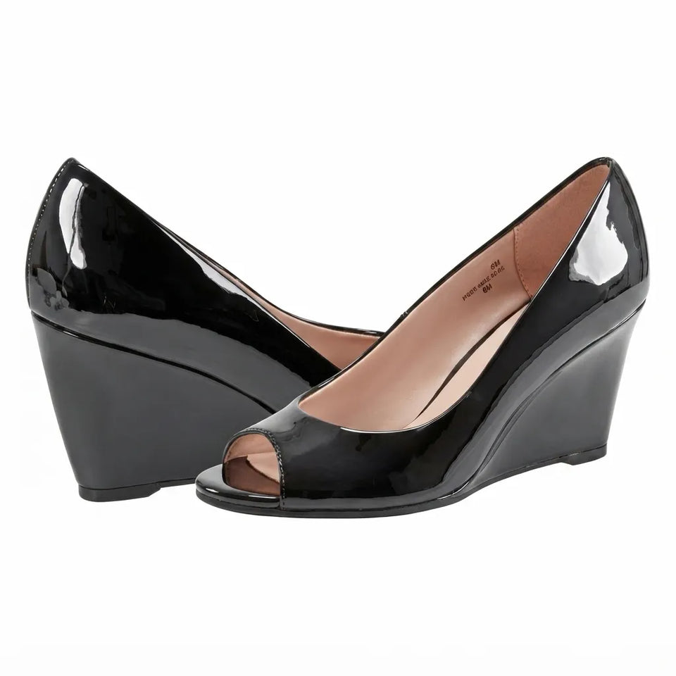 A pair of black patent leather wedge pumps with an open toe, displayed against a solid white background.