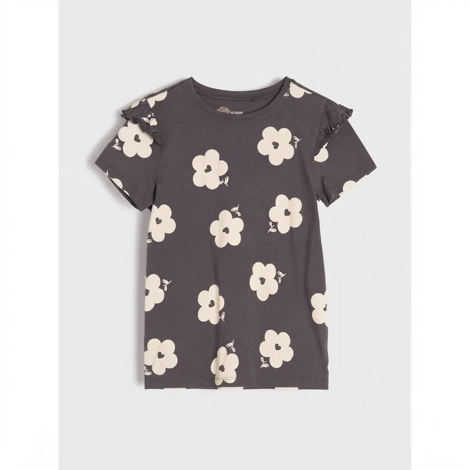 A dark gray short-sleeve t-shirt with a cream-colored floral print, featuring ruffled detailing on the shoulders, displayed flat against a light gray background.