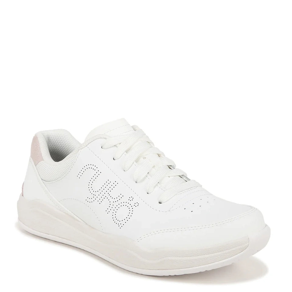 A white low-top sneaker with a perforated 'ny' logo on the side, white laces, and a thick white sole, shown against a plain white background.