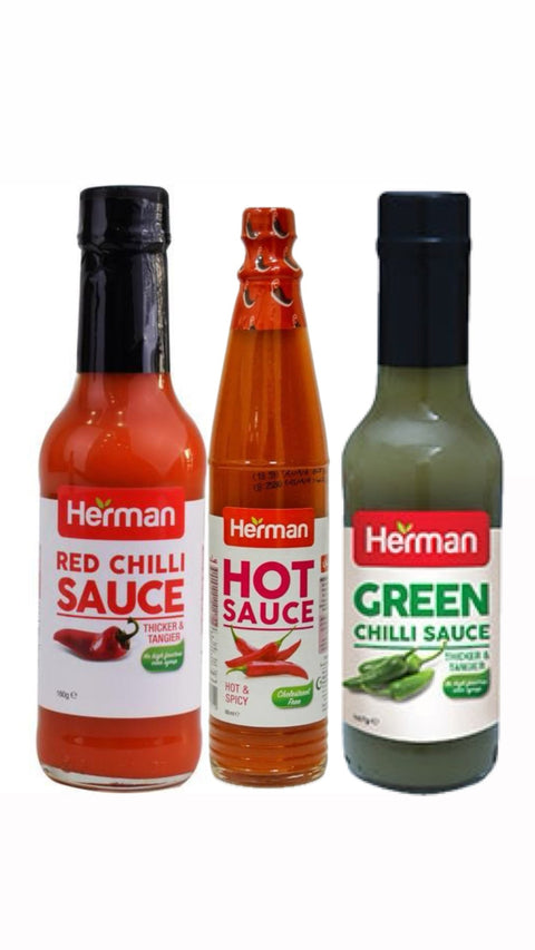 Three bottles of Herman hot sauces on a white background
