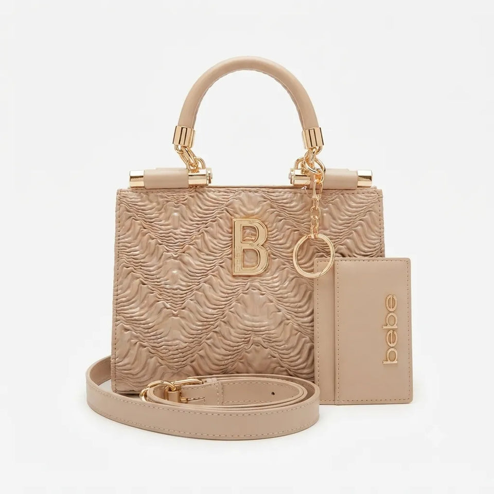 A beige textured leather handbag with a top handle, gold-tone hardware, a matching card holder, and a detachable shoulder strap, displayed on a light gray background.