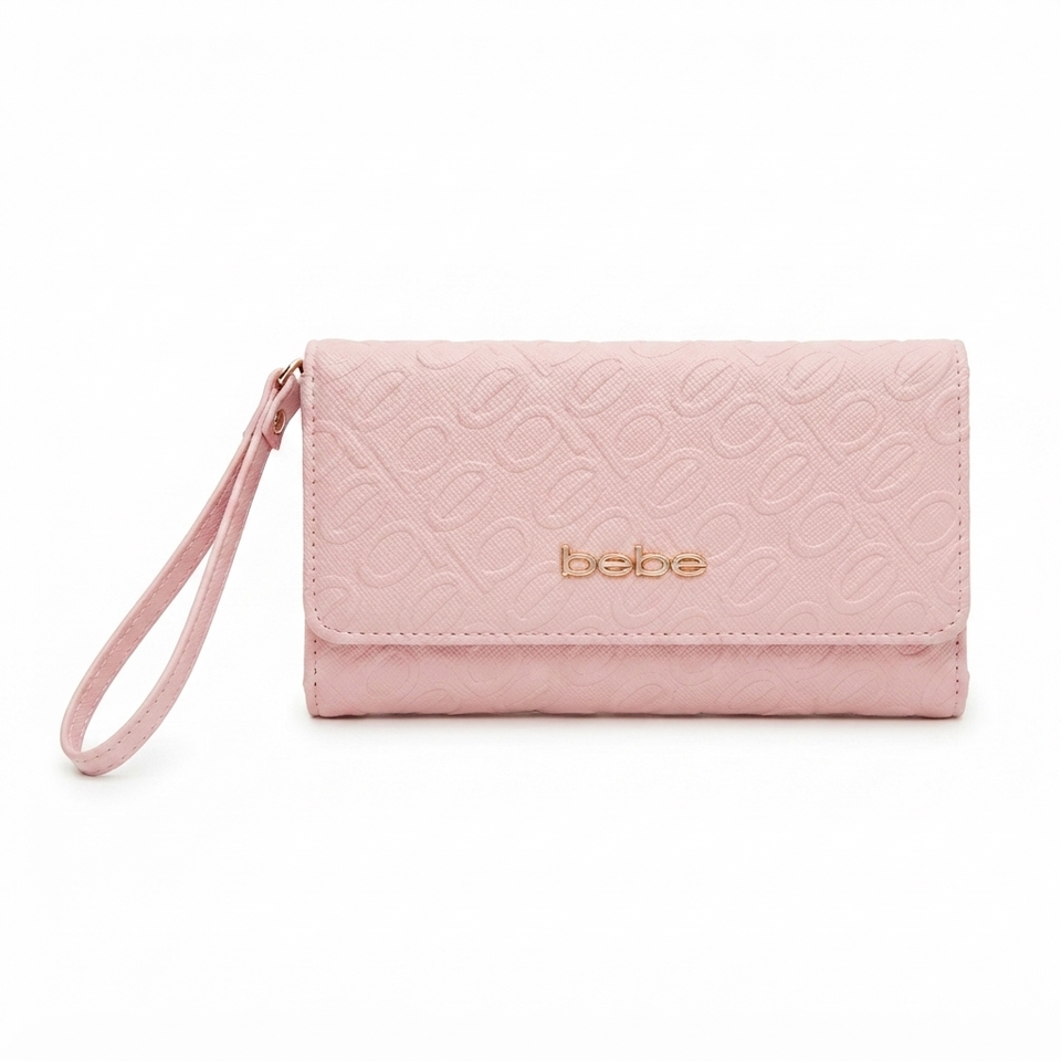 A light pink textured clutch wallet with a matching wristlet strap and a gold-tone 'babe' logo on the front, set against a plain white background.