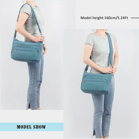 Person wearing a blue crossbody bag on a plain background