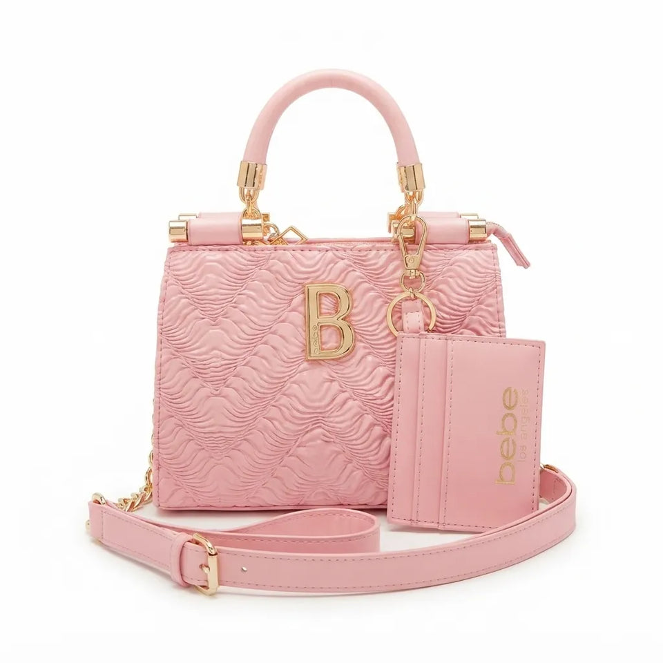 A pink textured leather handbag with a top handle, gold-tone hardware, a matching card holder, and a detachable shoulder strap, shown on a white background.