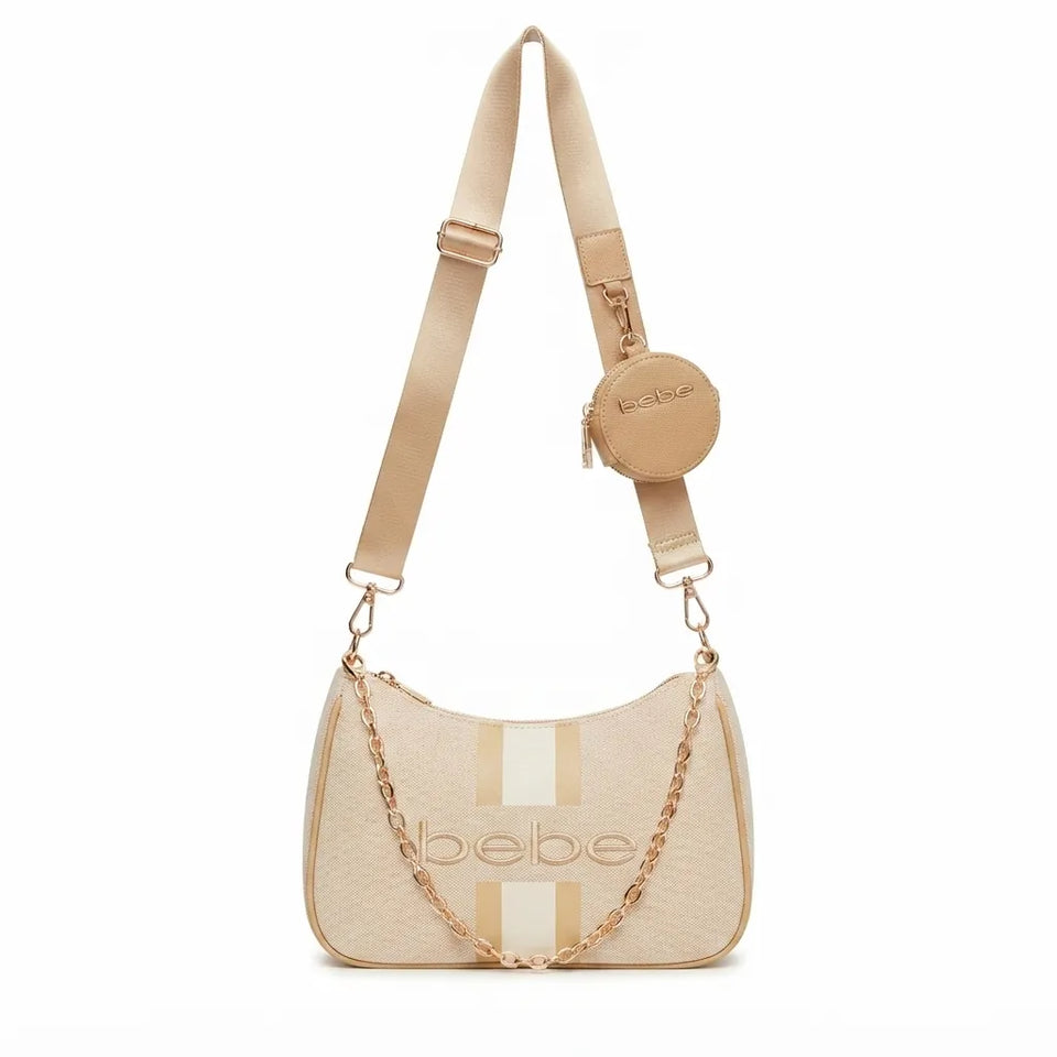 Bebe brand shoulder bag in beige textured leather with a matching beige fabric strap, gold-tone chain detail, and a small matching round pouch, shown on a plain white background.