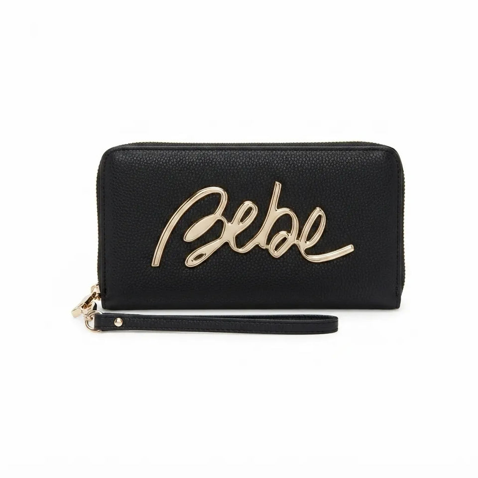 A black pebbled leather zip-around wallet with a wristlet strap, featuring a prominent metallic gold script logo on the front that reads 'Bebe'.