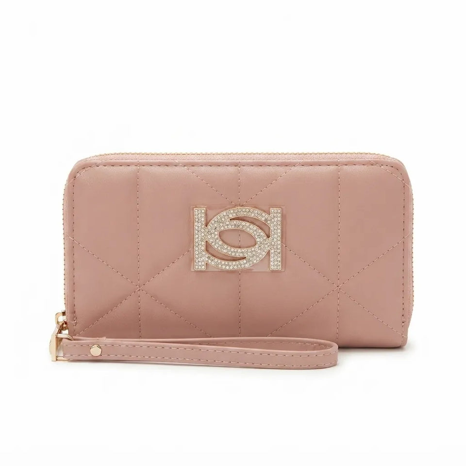 A dusty pink quilted zip-around wallet with a matching wristlet strap and a rhinestone-embellished 'HS' logo on the front, set against a plain white background.
