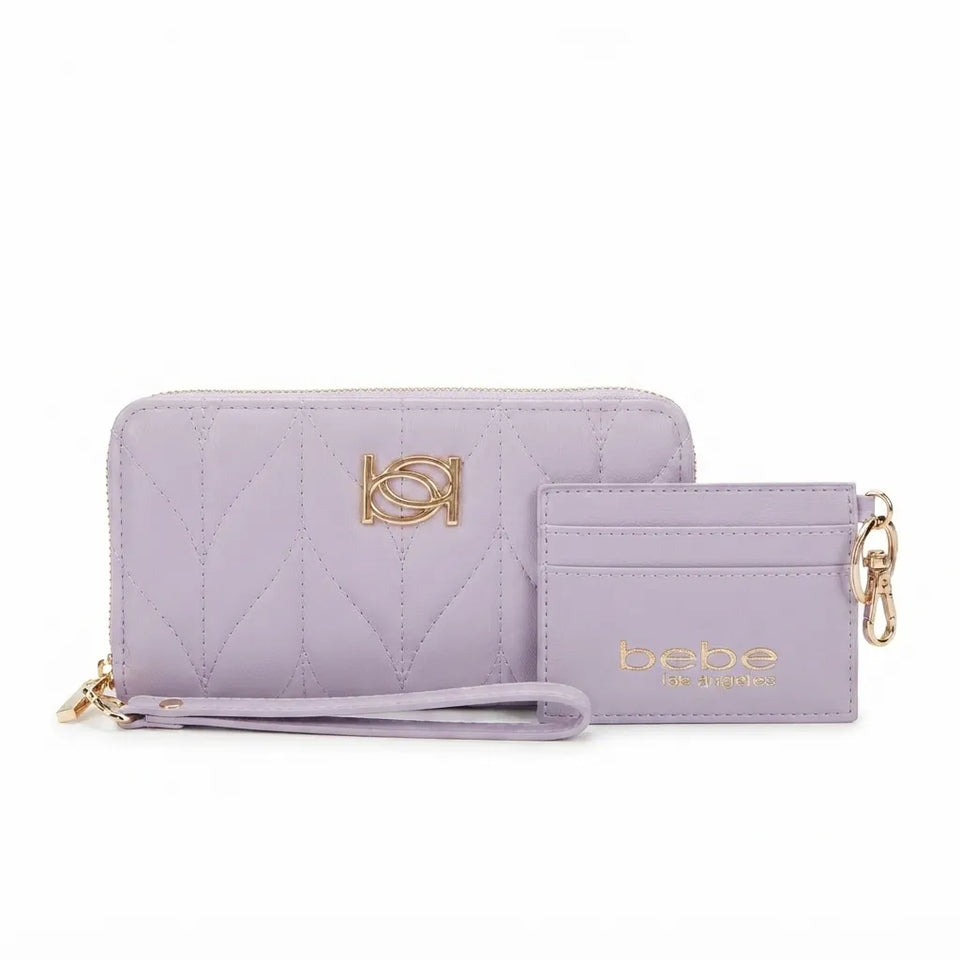 A light purple quilted wallet and matching wristlet pouch set with gold-tone hardware and logo details, displayed on a clean white background.