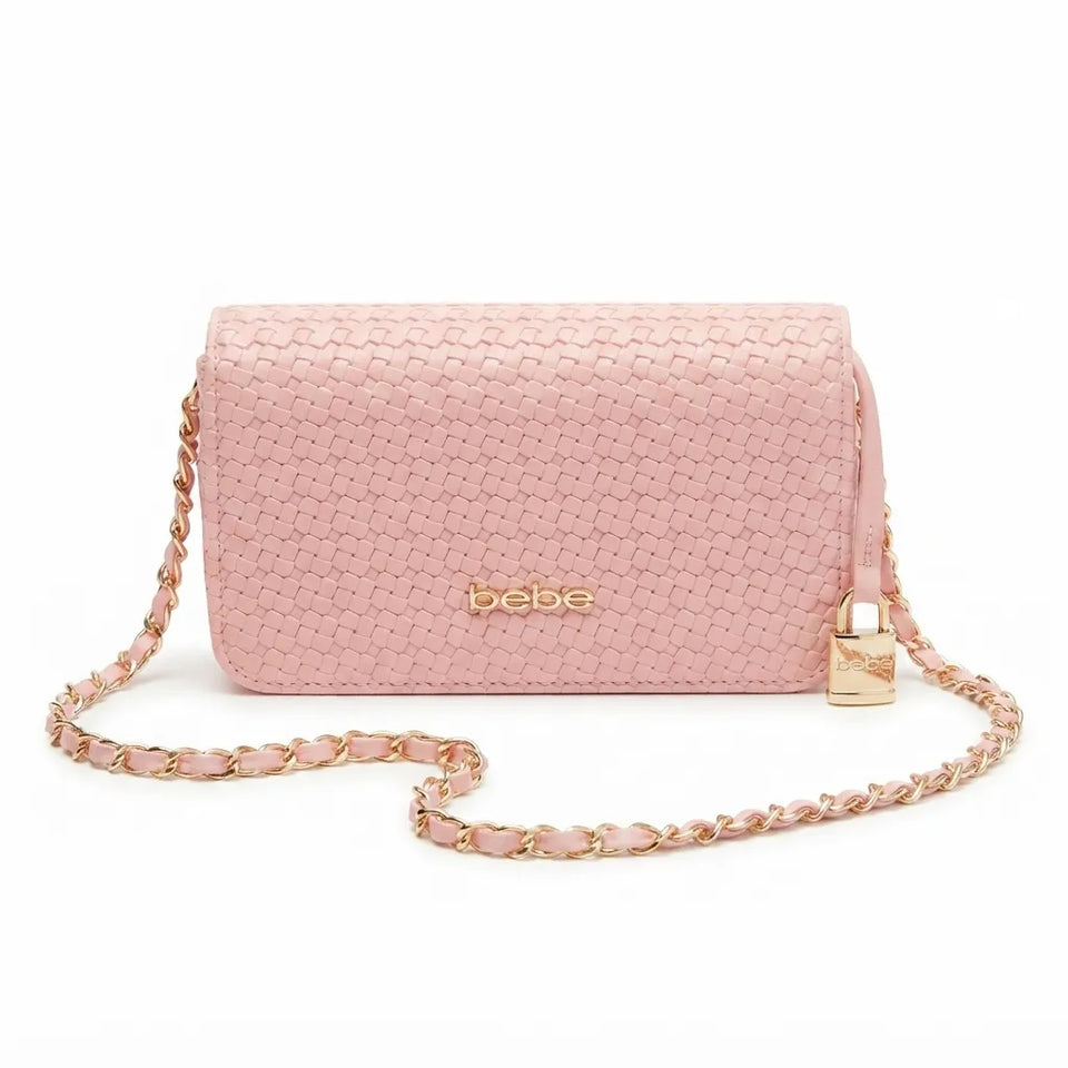 A light pink textured leather crossbody bag with a gold-tone 'bebe' logo on the front, a matching pink and gold chain strap, and a small gold padlock detail on the side, shown against a plain white background.