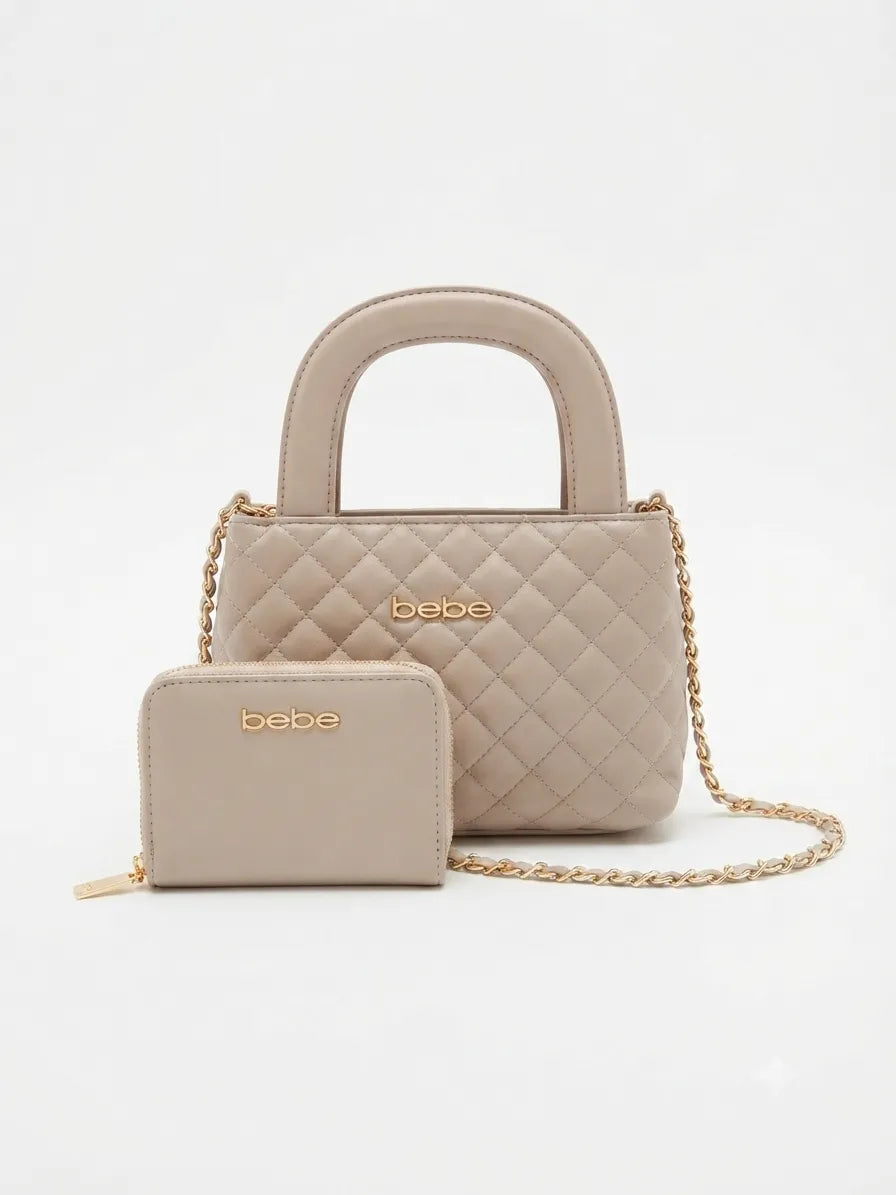 A light beige quilted handbag with a top handle and a matching zip wallet, both featuring gold-tone 'bebe' branding, displayed on a clean white background.