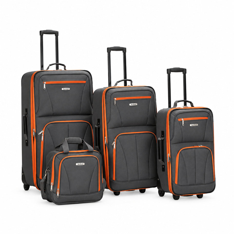 Set of gray suitcases with orange accents on a white background