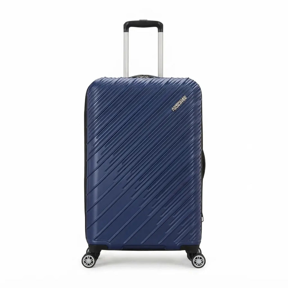 A navy blue hardshell suitcase with diagonal grooved lines, featuring a silver telescopic handle and four spinner wheels, shown on a white background.