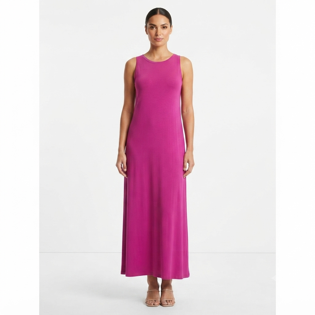 A woman modeling a sleeveless, scoop-neck maxi dress in a vibrant magenta pink, standing against a plain white studio background.