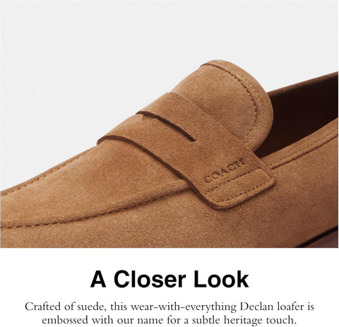 Close-up of a brown loafer with 'Coach' branding on a light gray background.