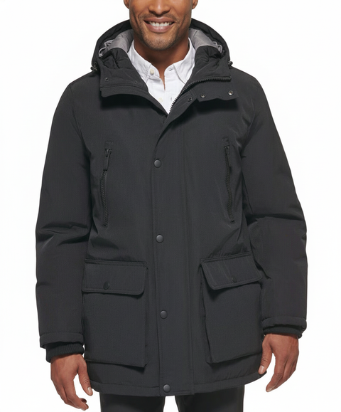 Man wearing a black parka jacket on a white background