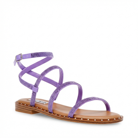 Purple strappy sandal with a brown sole on a white background