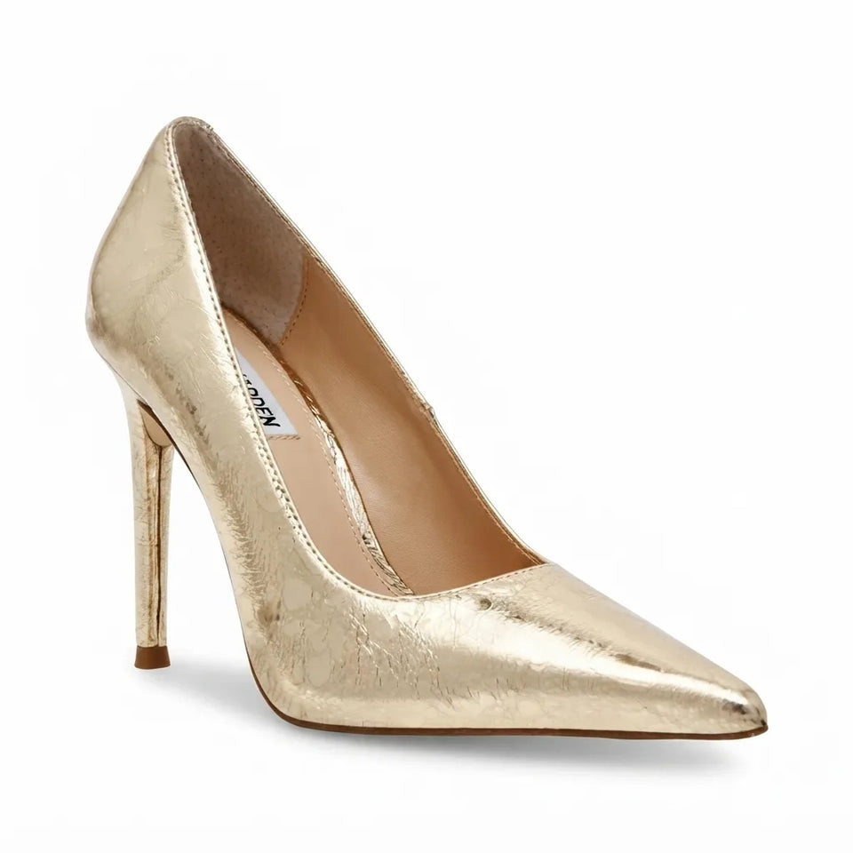 A metallic gold pointed-toe high heel pump with a textured finish, shown from a three-quarters angle on a white background.