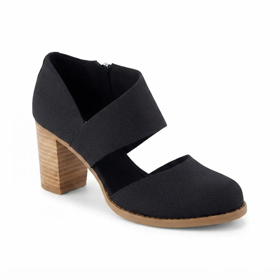 A single women's heeled shoe in black canvas-like fabric with a wide elastic ankle strap and a chunky wooden block heel, shown on a white background.