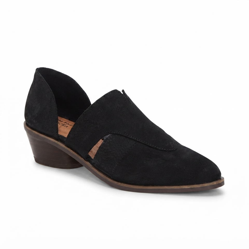 A single black suede slip-on shoe with a low brown wedge heel, shown from a three-quarters angle on a white background.