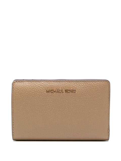Beige wallet with 'Michael Kors' logo on a white background