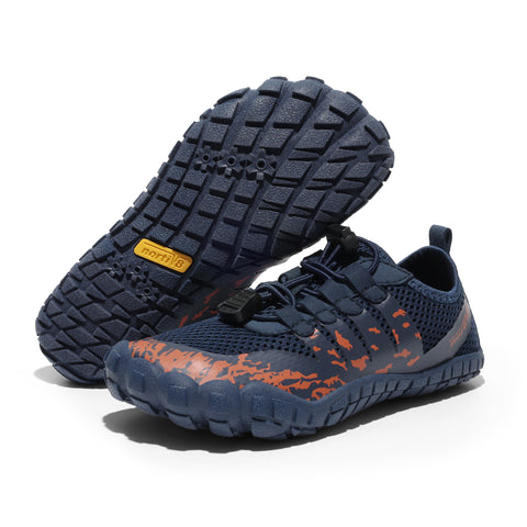Navy blue athletic shoes with orange accents on a white background