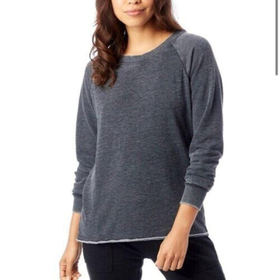 Woman wearing a gray long-sleeve shirt on a white background