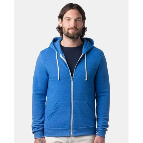 Man wearing a blue hoodie with a white zipper on a light gray background