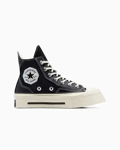 Black high-top sneaker with white laces and sole on a white background
