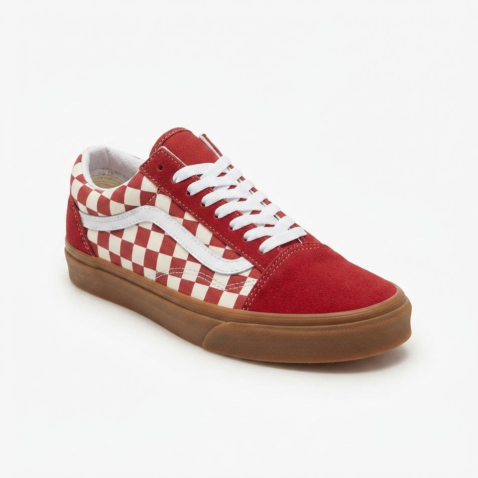 A single Vans Old Skool sneaker in red suede with a red and white checkerboard pattern on the side, white laces, and a brown gum sole, shown on a plain white background.