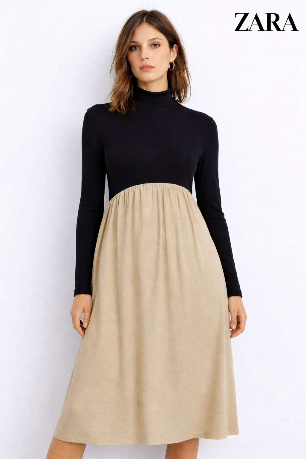 Woman wearing a black turtleneck and beige skirt with Zara branding.
