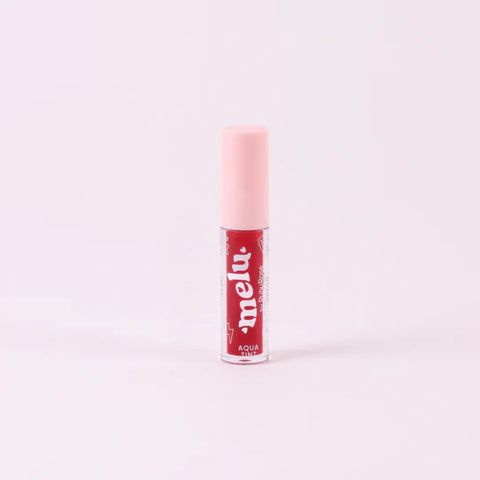 Lip balm with pink cap and visible brand name on a white background