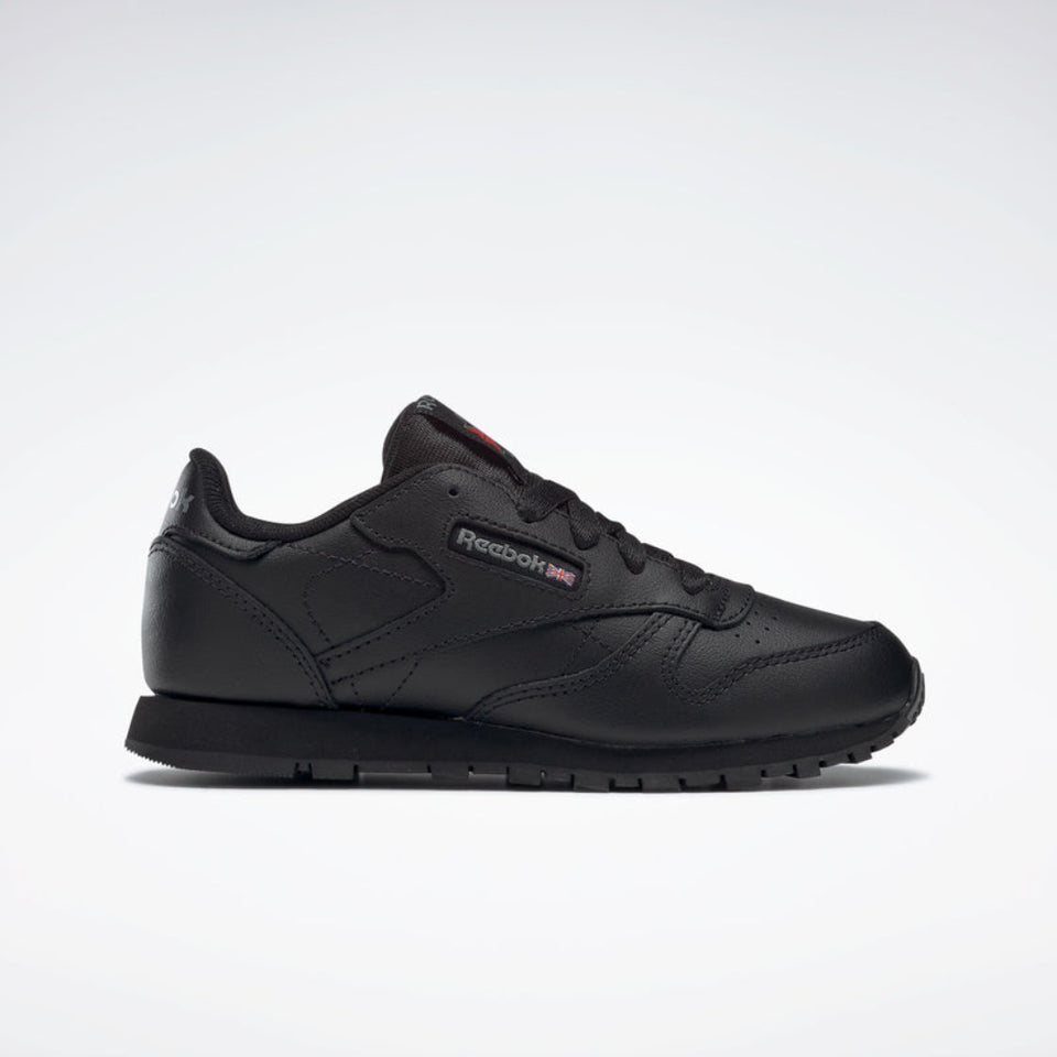 Black Reebok sneaker on a white background