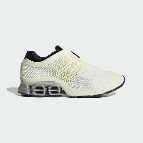 White athletic shoe with black accents on a light gray background