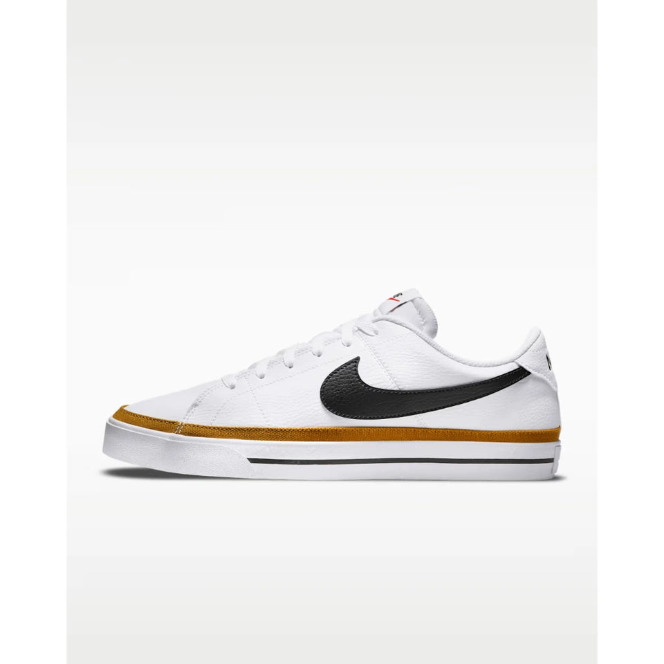 A white Nike low-top sneaker with a black Swoosh, a gold midsole stripe, and a white rubber sole, shown from a side profile view against a light gray background.