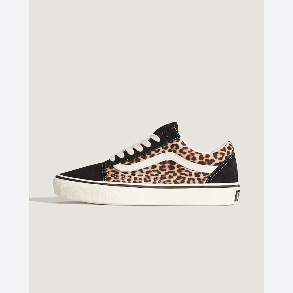 A single Vans platform sneaker featuring a black suede toe and heel, a leopard print canvas side panel, white laces, and a thick white platform sole.