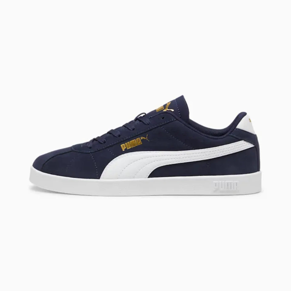 Navy and white sneaker with gold logo on a white background