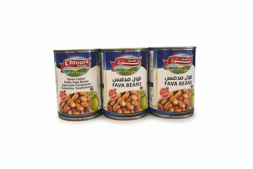 Three cans of Chtoura Fields Fava Beans, with labels showing the product name and the number of grams.