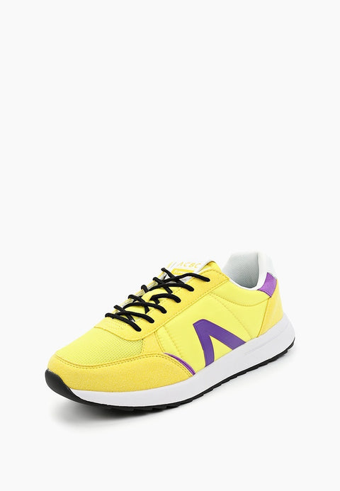 Yellow sneaker with black laces and purple accents on a white background