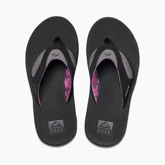 Pair of black flip-flops with pink accents on a white background