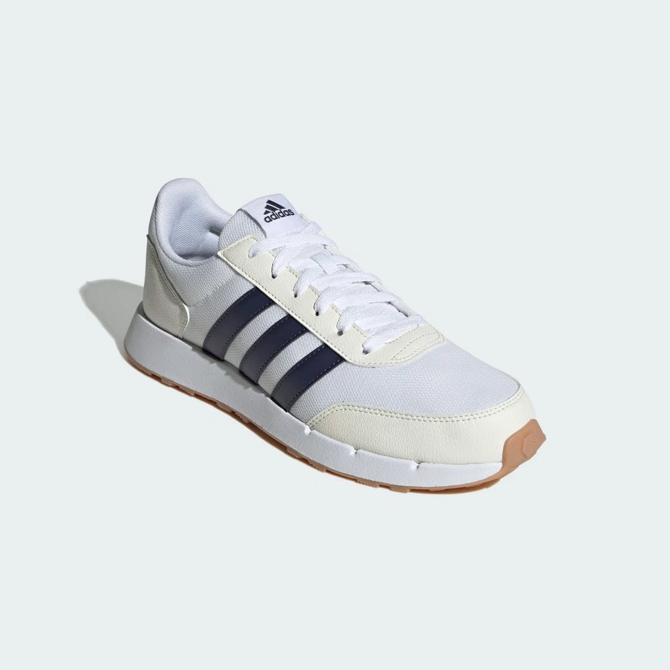 White Adidas sneaker with blue stripes on a white background