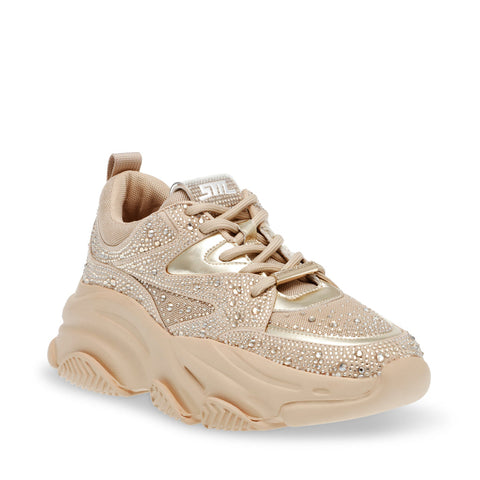 Beige sneaker with rhinestone embellishments on a white background