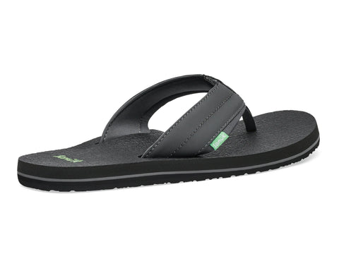 Black sandal with a green logo on a white background