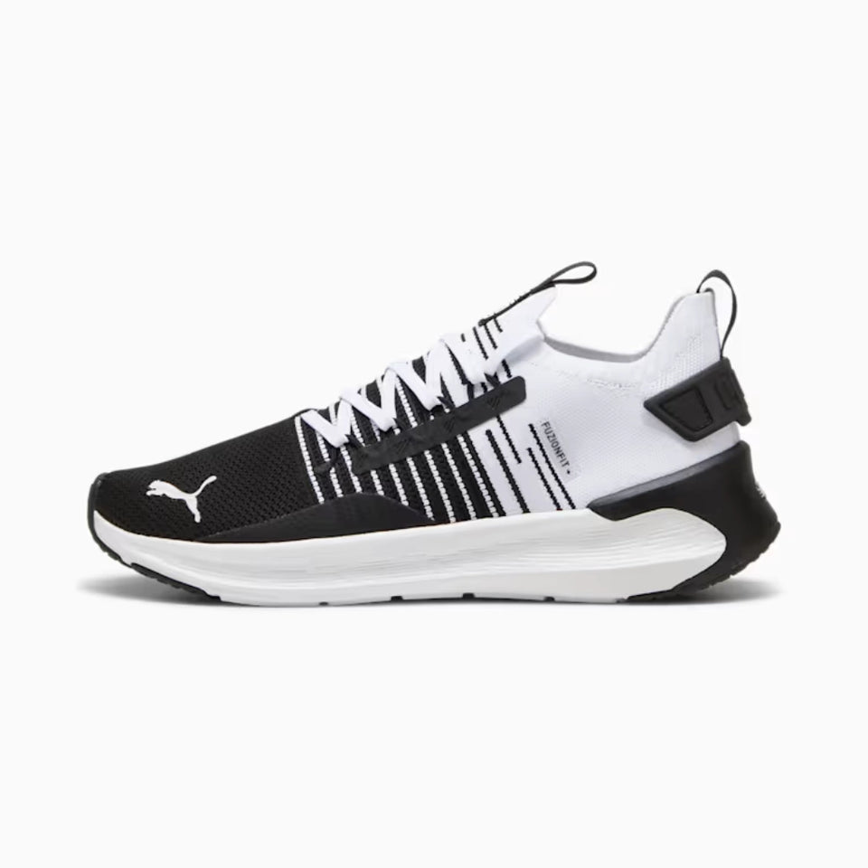 Black and white sneaker with brand logo on a white background