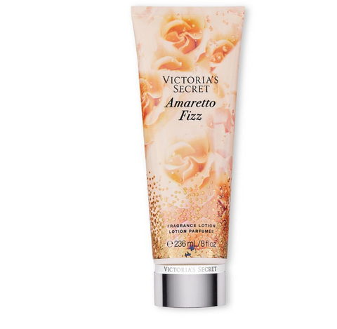 Victoria's Secret Amaretto Fizz lotion tube with floral design on a white background