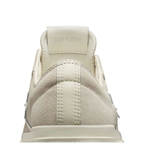 White sneaker displayed on a white background