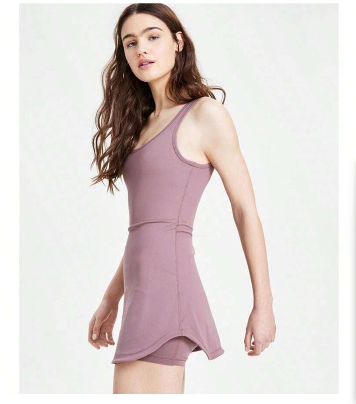 Woman wearing a mauve dress on a white background