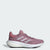 A single Adidas running shoe in a dusty rose pink colorway, featuring textured mesh and synthetic overlays, white three-stripes, a white midsole, and a black outsole, shown against a light gray background.