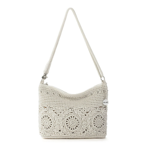 Crocheted handbag with a white background