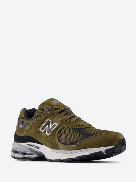 Brown sneaker with New Balance logo on a white background